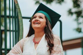 Latina graduate smiling