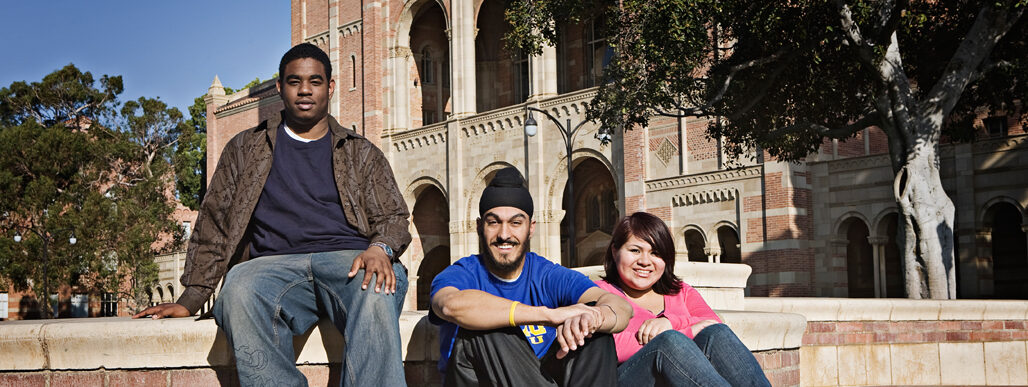 UCLA students sitting in front of a building