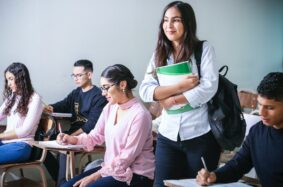 Female student standing in class