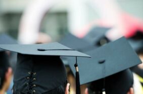 Students wearing graduation caps and tassels