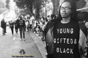 Young black man wearing Young, Gifted & Black t-shirt