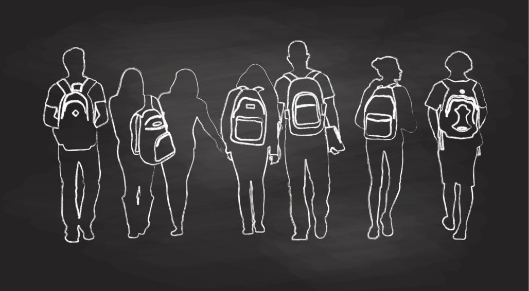 silhouette of students walking with backpacks