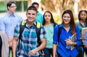 Group of diverse students walking on campus