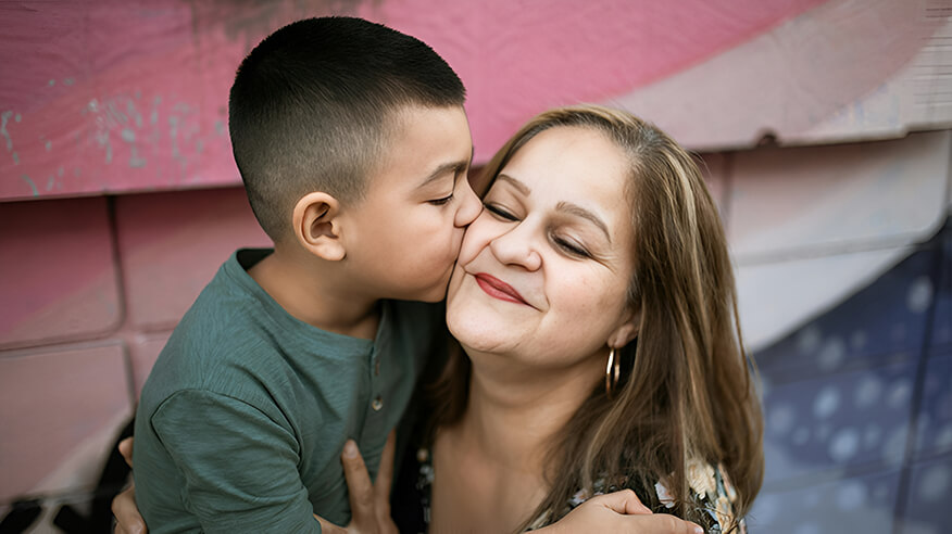 Golden-opportunites A little boy kissing an older lady on the cheek